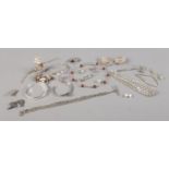 A quantity of unmarked white metal jewellery. To include brooches, bangles, chains etc.