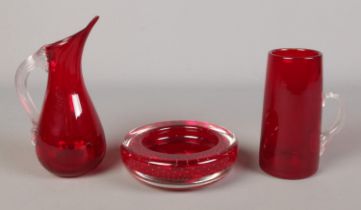 Three pieces of red Whitefriars style glass, including tall tankard and ashtray.