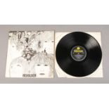 The Beatles: Revolver 33â…“RPM vinyl record, with sleeve and dust jacket. Yellow and Black
