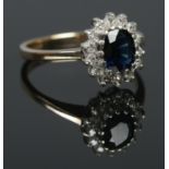 A 9ct gold Sapphire and Diamond cluster ring. Size JÂ½ Total weight: 2.14g
