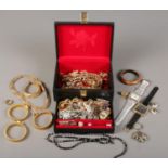 A jewellery box and contents of costume jewellery. Including rings, earrings, necklaces, watches,