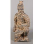 A Chinese terracotta army seated figure. (61cm x 30cm)