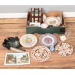 A box of miscellaneous. Including paper mache crumb tray and brush, framed printed tiles, art