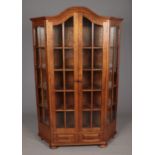 A large oak display cabinet with glass panel doors and two drawer base. (198cm x 130cm)