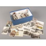 A box of vintage postcards. Senior & Co, Frith's, Valentine's etc.
