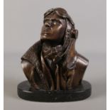 A Bronze bust depicting a fighter pilot, raised on marble base. Signed RS to back. 19cm high.