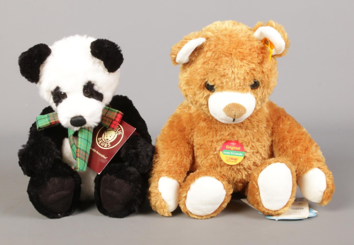 A Steiff 'Cosy Friends' teddy bear with buttoned ear, with Charlie Bears 'Bobble' panda.