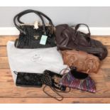 A box of handbags. Including clutch bag examples, etc.