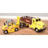 Two Tonka toy trucks. Includes wagon and pallet truck.