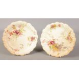 Two Royal Worcester blush plates decorated with flowers, in the 1416 pattern.