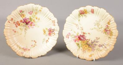Two Royal Worcester blush plates decorated with flowers, in the 1416 pattern.