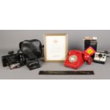 A small quantity of collectables, to include a series of Polaroid cameras, rotary telephone and