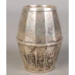 A silver money box formed as a barrel. Assayed Birmingham 1928. 80g Missing bottom.