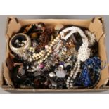 A box of costume jewellery. Including beads, bangles, necklaces, bracelets, etc.