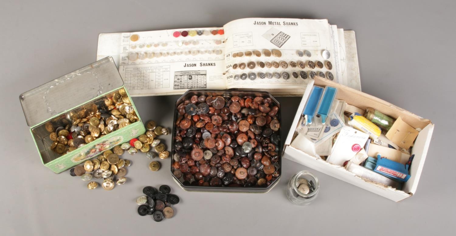 A large collection of buttons, to include military, transport and wooden examples.