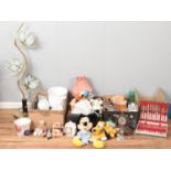 Four boxes of miscellaneous. Including Disney figures and teddies, brass and glass lamp, planters,