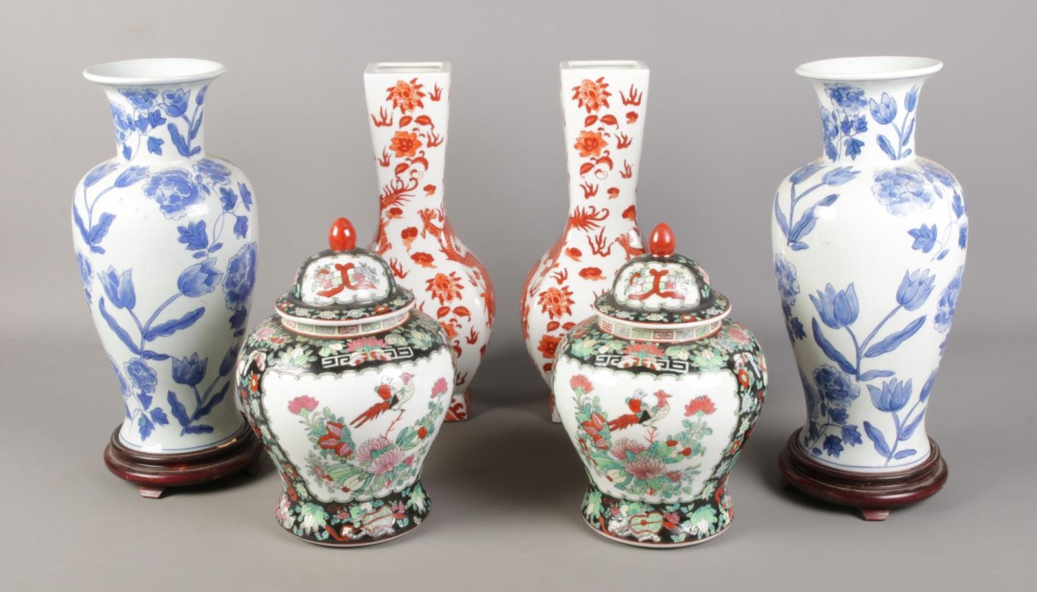 Three pairs of oriental vases, to include large blue and white baluster and lidded examples. Marks