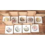 A box of nine Wedgwood Flower Fairies cabinet plates.
