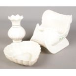 Three pieces of Belleek porcelain. Includes two Millennium pieces. Heart shaped bowl cracked.