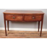 A 19th century mahogany bowfront side table with two drawers. (76cm x 117xm)