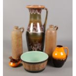 A collection of pottery. Includes large Kingston Pottery drip glaze jug, stoneware bottles, Pearsons