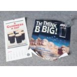 A Guinness Advertising Calendar from 1996 and two advertising posters. H:59cm W:42cm.