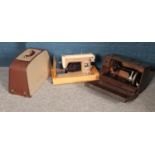 Two cased sewing machines. Including Skyliner example, etc.