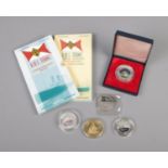 A collection of Titanic commemorative coins including Royal Mint commemorative medal and overseas