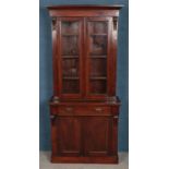 A Victorian mahogany bookcase with cupboard base. (198cm x 89cm)