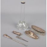 A quantity of silver and silver mounted items. Including jars, specimen vase, button hooks, etc.