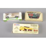 A trio of diecast vehicles including Matchbox Ford Model T and Corgi Mitchells and Butlers Truck.