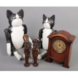 A quantity of woodenware. Including two painted jointed cats, figural pipes and holders and mantel