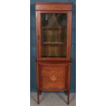 An Edwardian mahogany astragal glazed bookcase with cupboard base. With inlaid decoration. (182cm