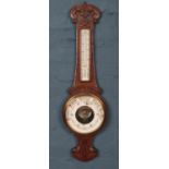 An oak carved banjo Barometer. Patent no 16536. H: 85cm W:25cm.