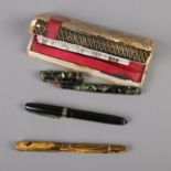 A trio of Marie Todd Swan fountain pens including one with 14ct gold nib. One pen is missing nib.