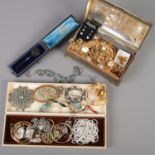 Two small boxes of costume jewellery. Includes antique yellow metal stick pin, gold plated examples,