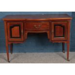 A mahogany knee hole desk with inlaid decoration. Centre door flanked by two cupboards. (78cm x