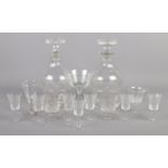 A collection of Victorian and Edwardian glass. Includes decanters, etched glasses, custard cups etc.