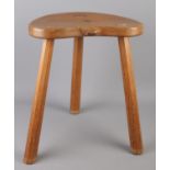 Robert 'Mouseman' Thompson, a carved oak three legged stool with signature mouse.