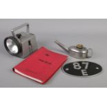 A collection of railwayana. Includes NRS bardic lamp, flare lamp, locomotive shed plate and a