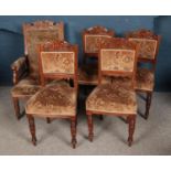Five walnut upholstered chairs including grandfather chair on castor wheels.