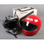 A Genius No. 7 motorbike helmet along with a child's Lazer helmet.