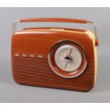 A Bush 'Antique' Radio with Wood effect and cream face. Power cord missing.