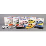 A collection of five boxed Burago metal kit scale models. To include 2002 Aston Martin Vanquish (1/