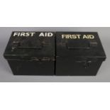 Two metal first aid boxes with contents of medical supplies.