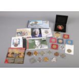 A quantity of commemorative coins including Naval, Royal and War related examples.