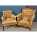 Two green buttoned upholstered armchairs. Raised on turned mahogany supports.