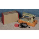 A cased Viceroy Model H sewing machine with manual.