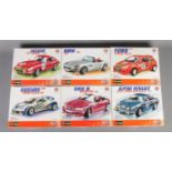 A set of six boxed Burago metal kit scale models. To include 2000 BMW Z8 (1/18), 1961 Jaguar E Coupe