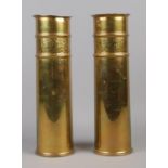 A pair of WWI Trench Art artillery shell vases, with decorative collars. Stamped 1916 with Broad